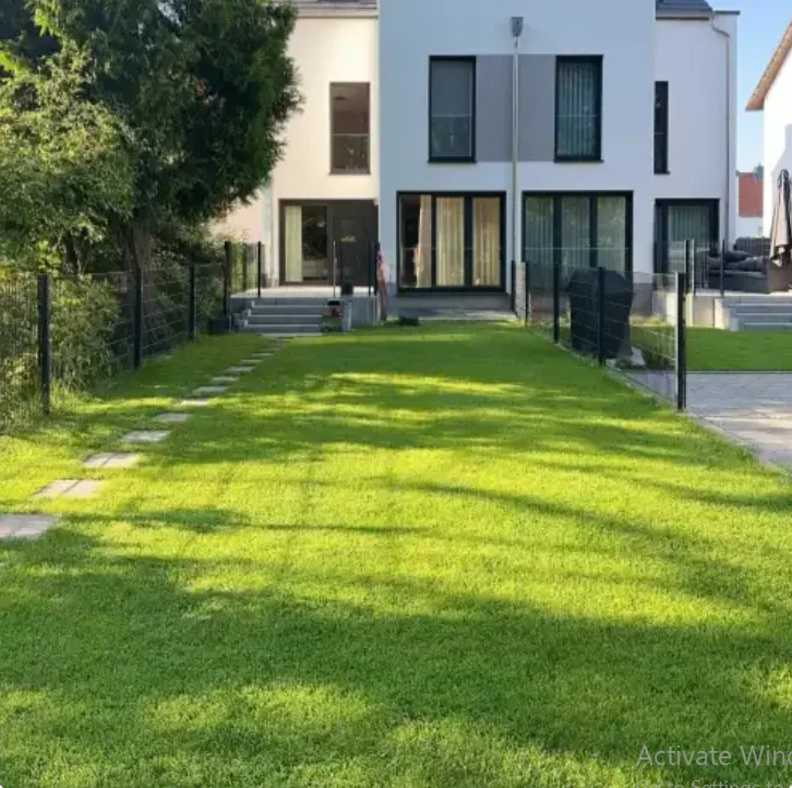 Even grass seed coverage and light watering during planting